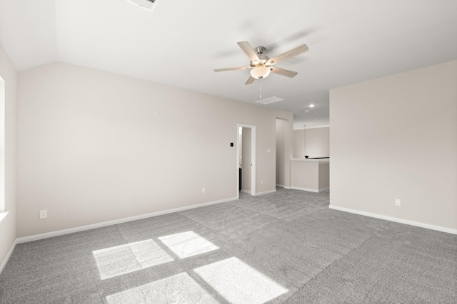 spare room with carpet flooring, ceiling fan, and lofted ceiling