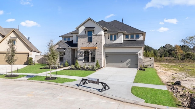 view of front of house with a front lawn and a garage