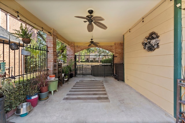 view of patio / terrace with a gate and ceiling fan