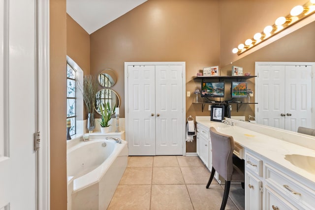 full bathroom with double vanity, tile patterned flooring, a closet, and lofted ceiling