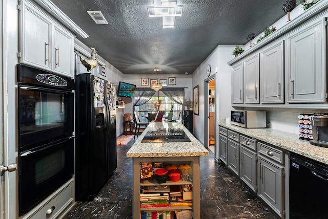 kitchen featuring a textured ceiling, black appliances, visible vents, and gray cabinetry