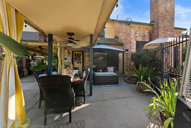 view of patio / terrace featuring a ceiling fan, outdoor dining area, and fence