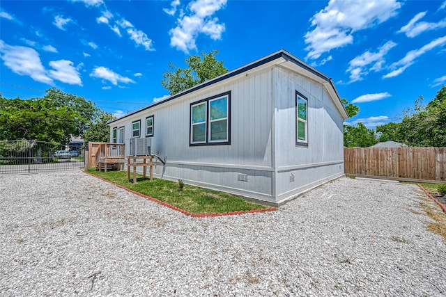 view of property exterior featuring a wooden deck