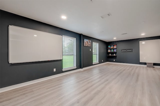 home theater with light hardwood / wood-style flooring