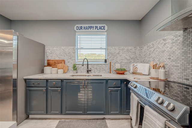 kitchen featuring light tile patterned flooring, sink, wall chimney exhaust hood, stainless steel appliances, and decorative backsplash