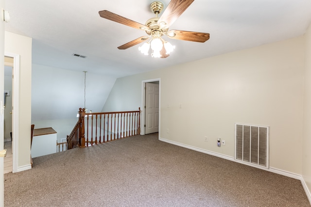 unfurnished room featuring lofted ceiling, carpet, and ceiling fan