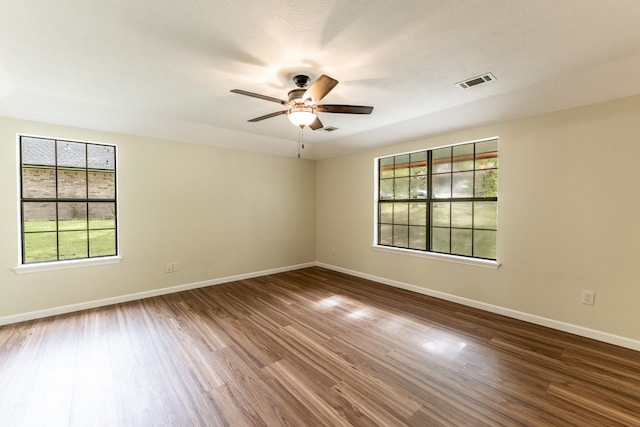 unfurnished room featuring ceiling fan and hardwood / wood-style flooring