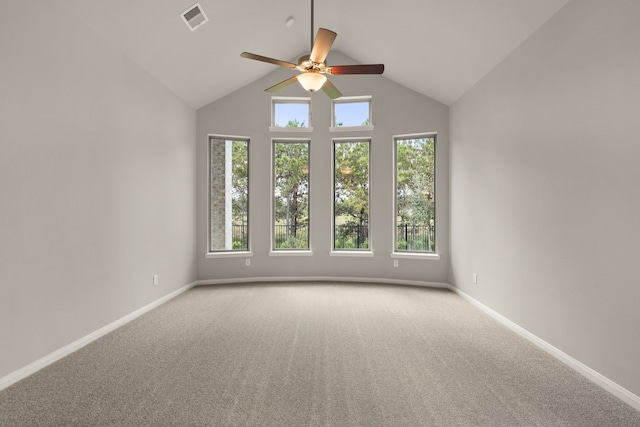 carpeted spare room featuring ceiling fan and high vaulted ceiling