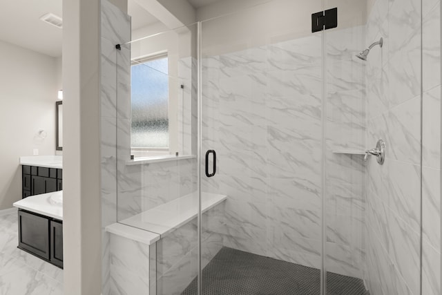 bathroom featuring an enclosed shower and vanity