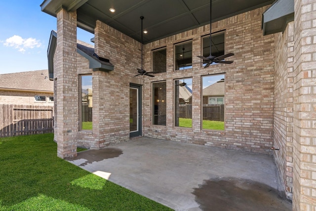 view of patio featuring fence and a ceiling fan