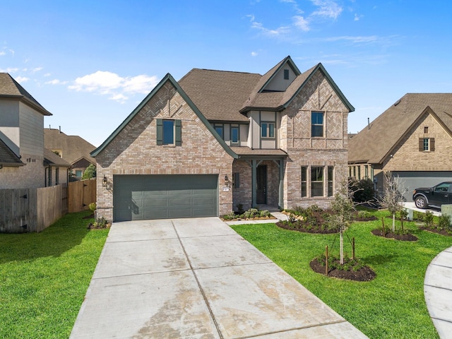 view of front of house featuring brick siding, fence, driveway, roof with shingles, and a front lawn