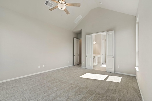 unfurnished bedroom featuring high vaulted ceiling, visible vents, light carpet, and baseboards