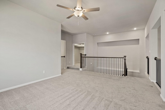 carpeted empty room with recessed lighting, ceiling fan, and baseboards