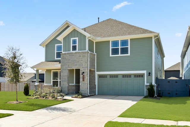 view of front facade featuring a garage and a front yard