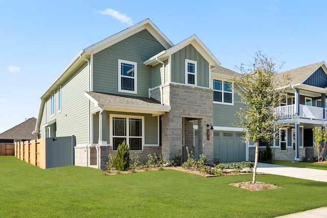 craftsman-style house with a garage and a front lawn