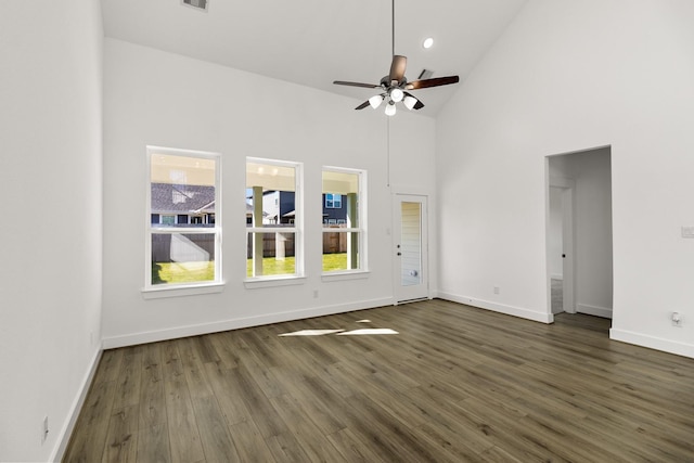 unfurnished room featuring dark hardwood / wood-style flooring, high vaulted ceiling, and ceiling fan