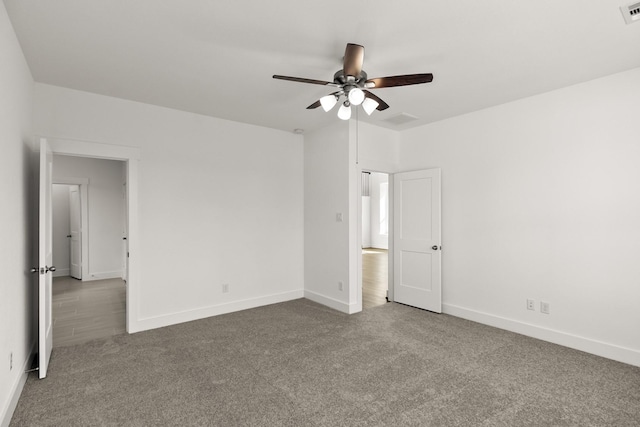 empty room with carpet and ceiling fan