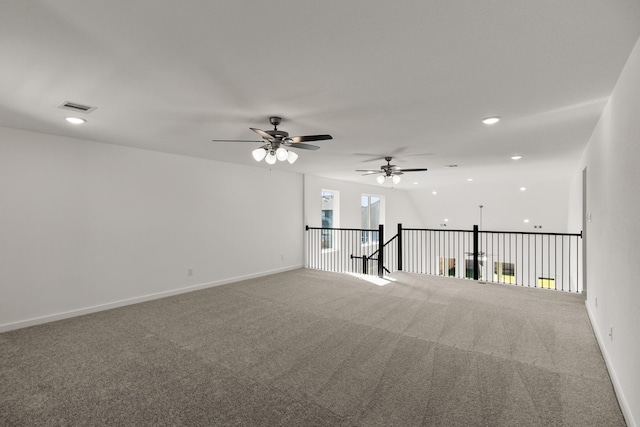 spare room featuring carpet flooring and ceiling fan