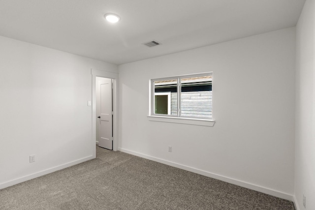 empty room featuring carpet flooring