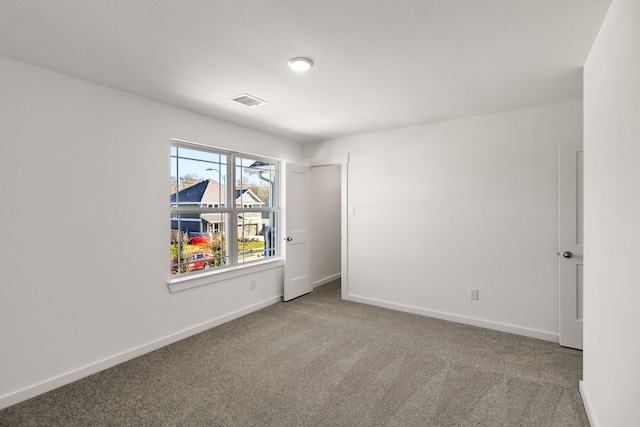 empty room with carpet flooring