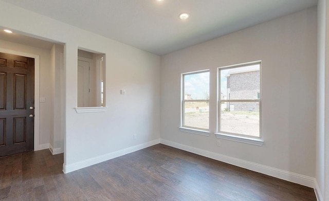 empty room featuring dark hardwood / wood-style floors