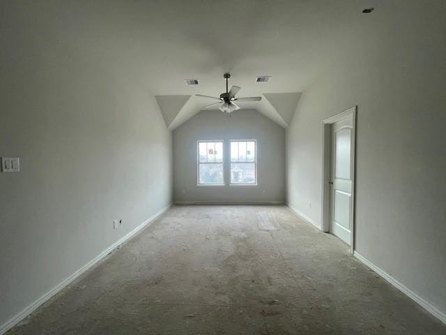 additional living space with ceiling fan, light colored carpet, and lofted ceiling