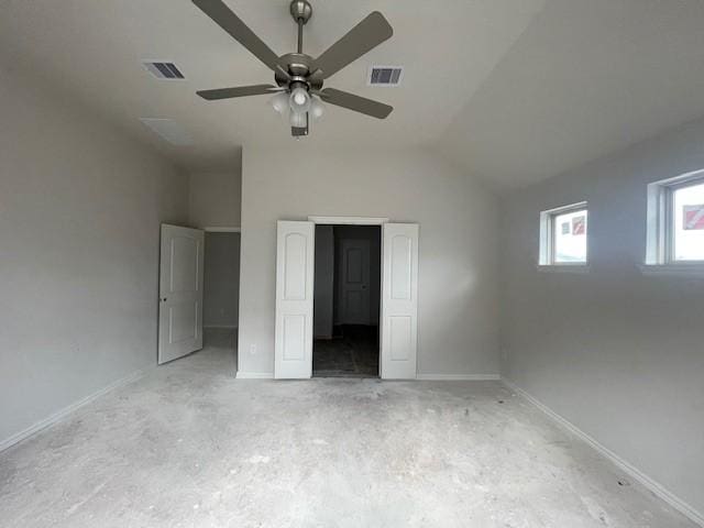 unfurnished bedroom featuring ceiling fan and lofted ceiling