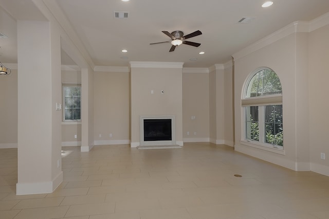 unfurnished living room featuring ceiling fan and crown molding