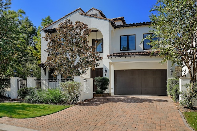 mediterranean / spanish-style home featuring a garage