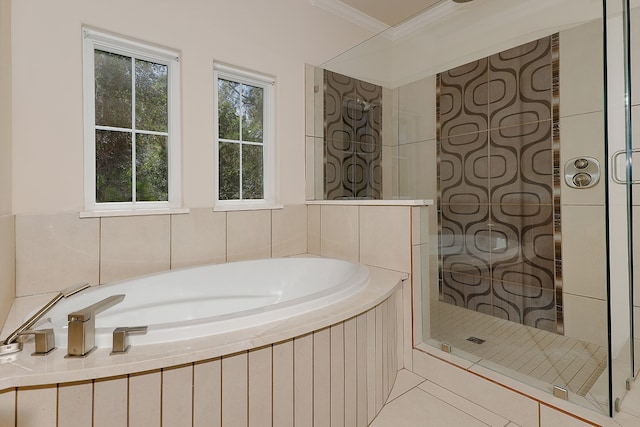 bathroom featuring plus walk in shower, tile patterned flooring, and crown molding