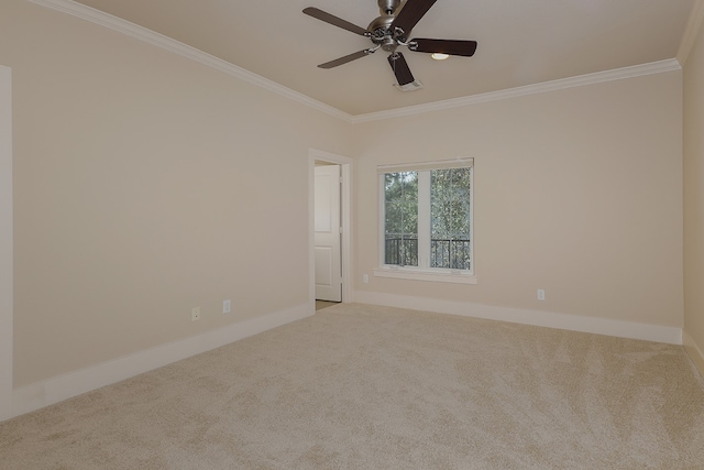 carpeted spare room with ornamental molding and ceiling fan