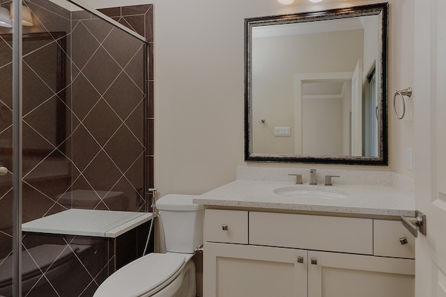 bathroom featuring walk in shower, vanity, and toilet