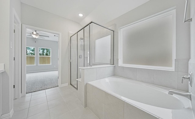 bathroom with tile patterned floors, ceiling fan, and plus walk in shower