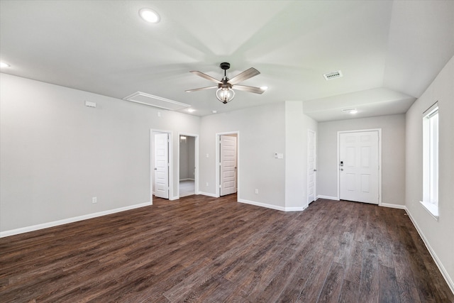 empty room featuring ceiling fan, plenty of natural light, and dark hardwood / wood-style floors