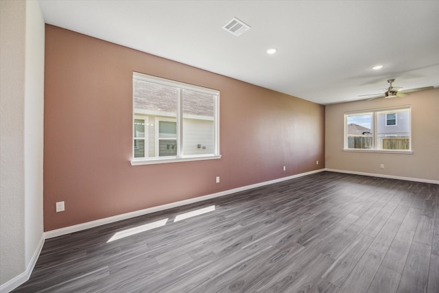 unfurnished room with ceiling fan and wood-type flooring