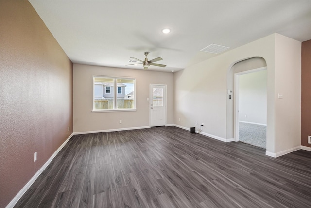 unfurnished room featuring dark hardwood / wood-style floors and ceiling fan