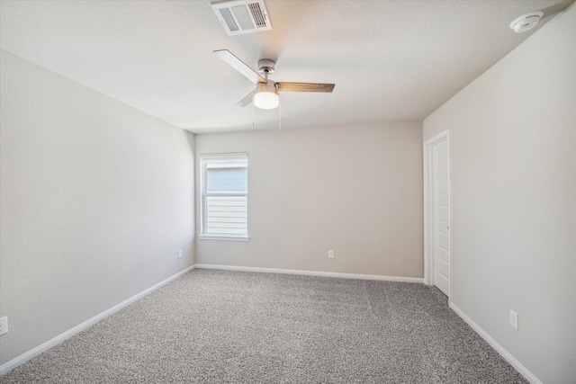 carpeted empty room with ceiling fan