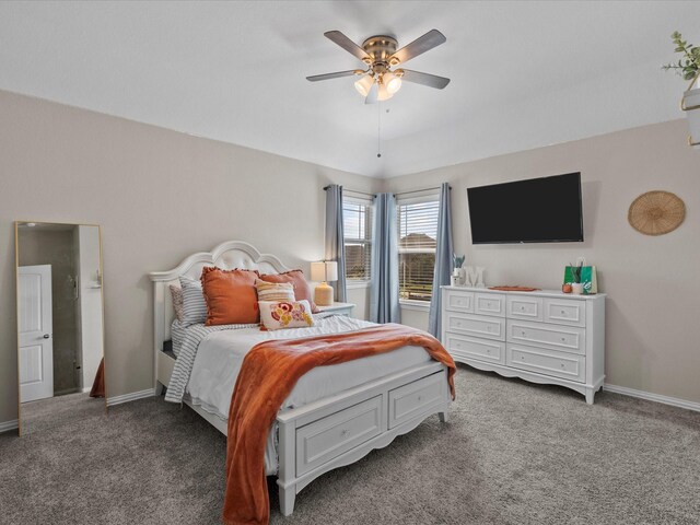 bedroom featuring ceiling fan and carpet