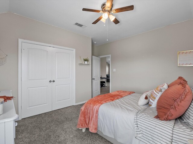 carpeted bedroom featuring a closet and ceiling fan