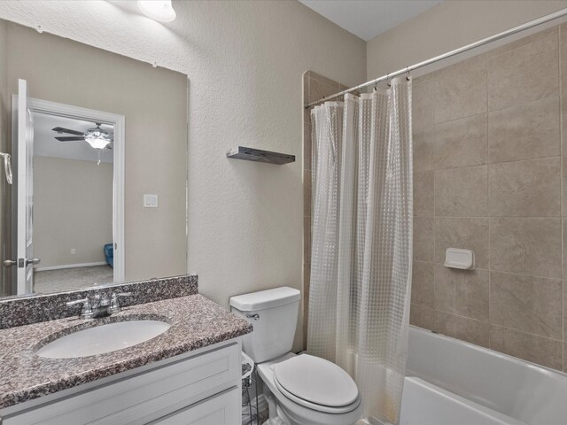 full bathroom with toilet, shower / bath combination with curtain, ceiling fan, and vanity