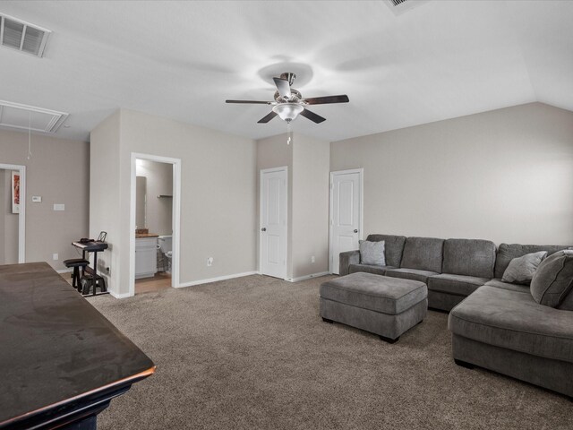 carpeted living room with ceiling fan and lofted ceiling