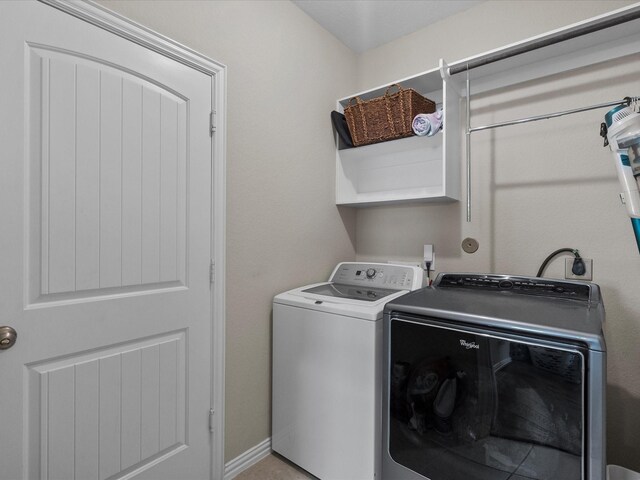 laundry area with washing machine and clothes dryer