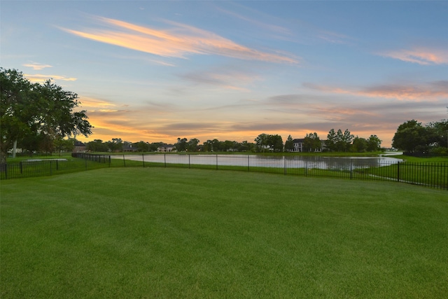 yard at dusk with a water view