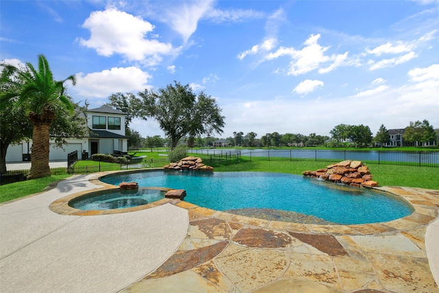 view of swimming pool featuring a patio, an in ground hot tub, and a yard