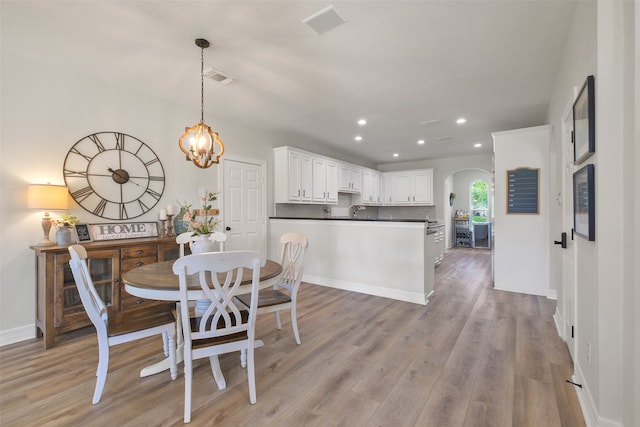 dining room with light hardwood / wood-style flooring