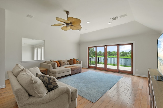 living room featuring light wood-type flooring and ceiling fan