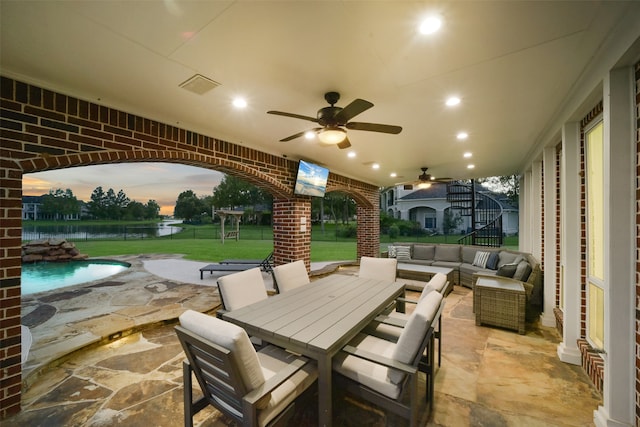 view of patio featuring an outdoor hangout area and ceiling fan