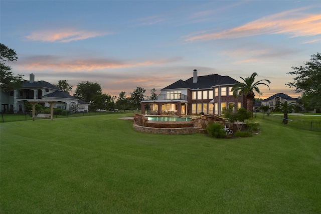 yard at dusk with a gazebo