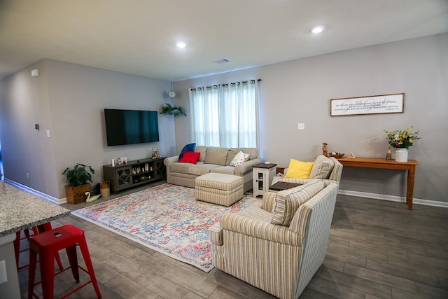 living room with dark hardwood / wood-style flooring