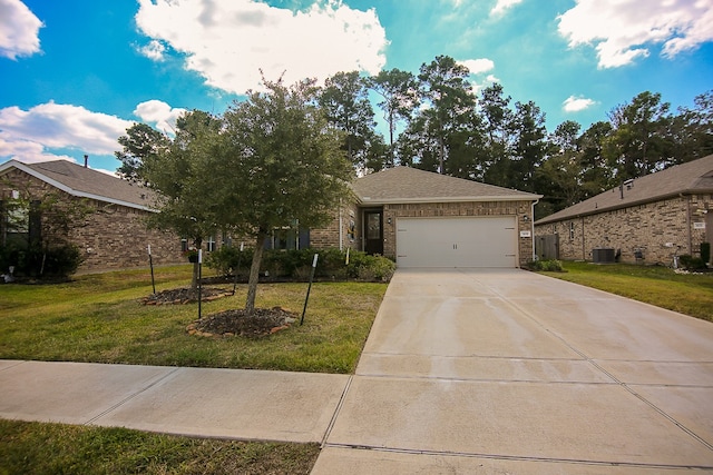 view of front of property with a front yard, a garage, and central AC unit